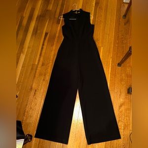 BCBG black jumpsuit. Never worn. Size M